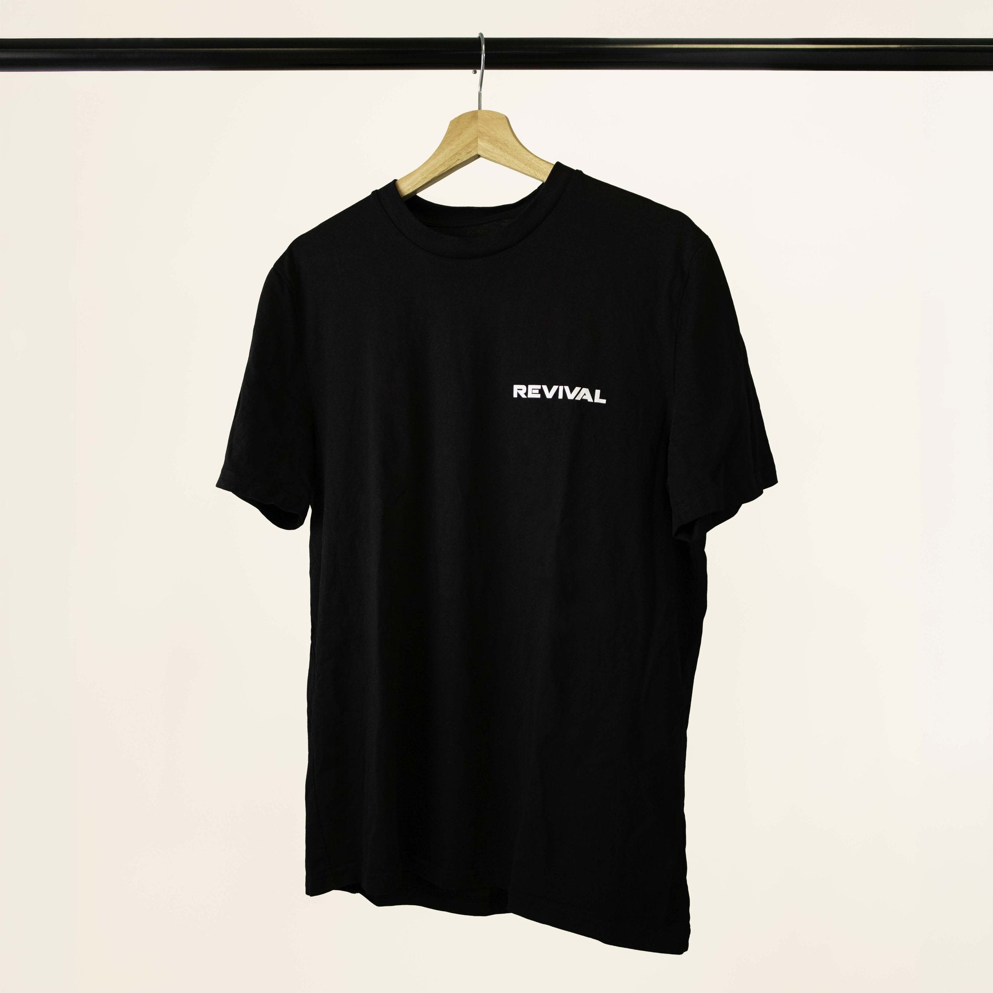 Revival black T-shirt, angled front view with white chest logo