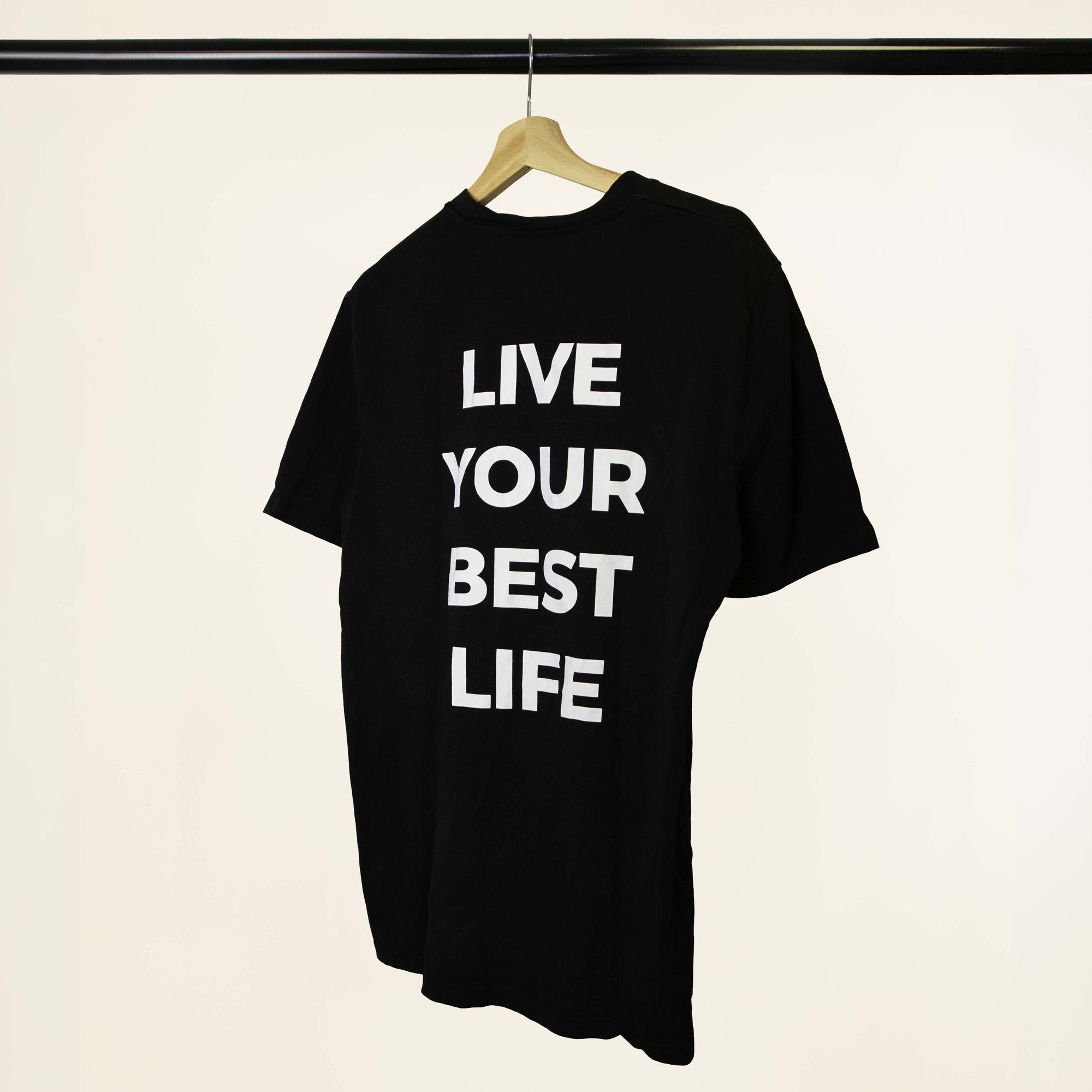 Revival black T-shirt, angled back view with Live Your Best Life print